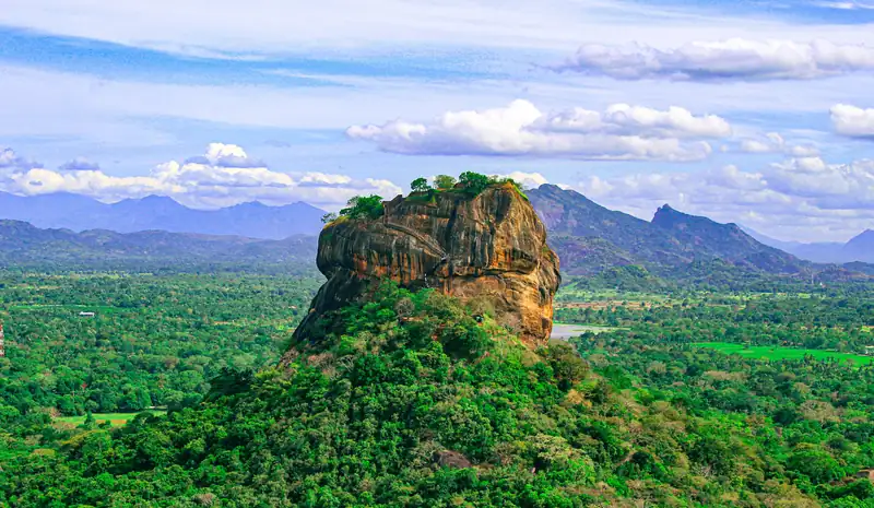 Sigiriya Lion Rock rising above the jungle at sunrise